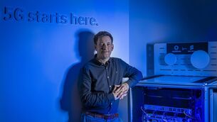 <p>Chris Byrne, solutions specialist with Vodafone Business Ireland, in front of a mobile private network. </p>