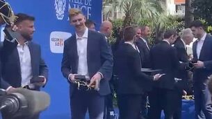 <p>SUITED AND BOOTED: The Scotland squad braved testing conditions for their official welcome in Nice.</p>