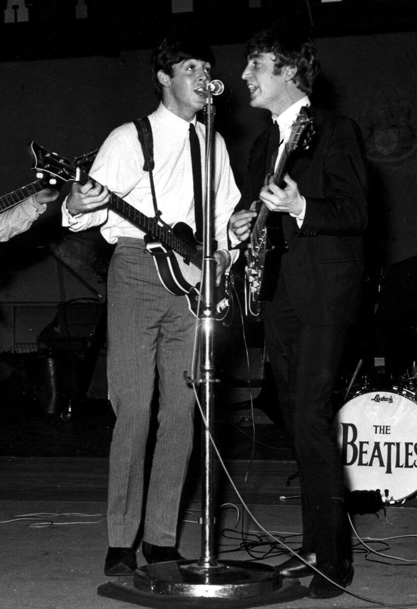 Paul McCartney (left) and John Lennon on stage in London during a recording session for the BBC radio programme 'Easy Beat' in 1963. File photo: PA