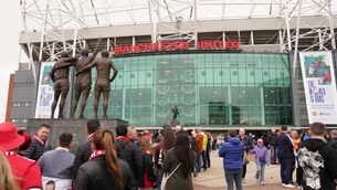 <p>SHARE PRICE PLUMMETS: Fans outside Old Trafford. Pic: PA</p>