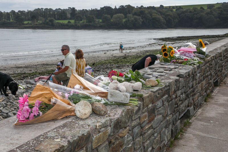 lowers left on the wall by Fountainstown Beach of as a tribute to Emili Roman who lost her life in a tragic incident on Tuesday. Picture: David Creedon lowers left on the wall by Fountainstown Beach of as a tribute to Emili Roman who lost her life in a tragic incident on Tuesday. Picture: David Creedon