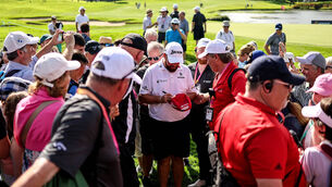<p>POPULAR: Shane Lowry signs autographs for fans after his round. Pic Credit ©INPHO/Ben Brady</p>