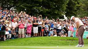 <p>Rory McIlroy putts for a birdie on the 9th green. Pic Credit ©INPHO/Ben Brady</p>