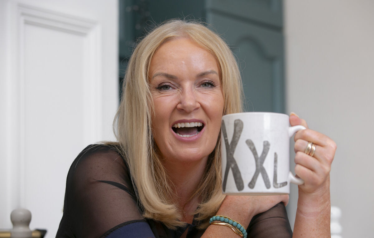 Ciara Kelly with an extra large cup of coffee at her home in Greystones, Co Wicklow. Photo: Gareth Chaney/Collins Photos