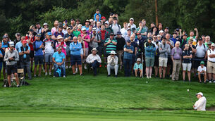 <p>WATCHING BRIEF: The crowd looks on as Rory McIlroy chips onto the 10th green on day one of the Irish Open.  	Picture: Inpho/Ben Brady</p>