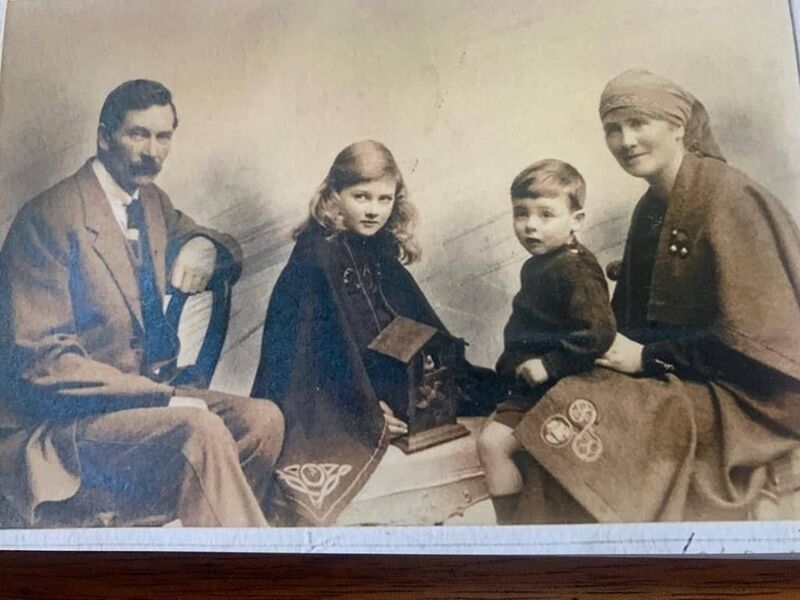 Máirín's father Liam Sheehan, Máirín, her brother Sean and mother Annie (née Dinneen), circa 1921. Annie designed the dress Máirín is wearing, using a Celtic design copied from one of the stained-glass windows in St Mary's Cathedral in Killarney. Photo courtesy of Maurice O'Keeffe Máirín's father Liam Sheehan, Máirín, her brother Sean and mother Annie (née Dinneen), circa 1921. Annie designed the dress Máirín is wearing, using a Celtic design copied from one of the stained-glass windows in St Mary's Cathedral in Killarney. Photo courtesy of Maurice O'Keeffe