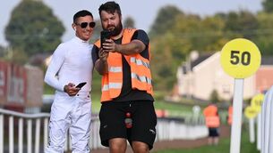 <p>RACING ROYALTY AT DOWN ROYAL: Down Royal groundsman Kelvin Eastwood gets a selfie during Frankie Dettori’s visit to the track. Pic: Healy Racing</p>