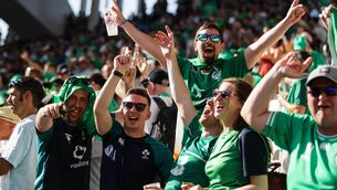 <p>Ireland fans celebrate after the game. Pic Credit ©INPHO/Laszlo Geczo</p>