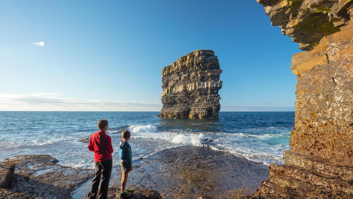 Dun Briste sea stack can be admired from the shore beneath Downpatrick Head. Dun Briste sea stack can be admired from the shore beneath Downpatrick Head.