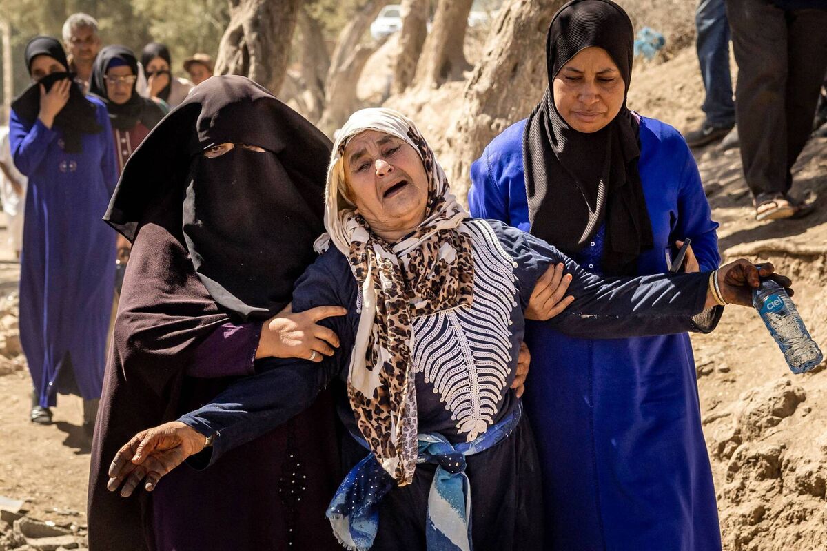 A woman is helped as she reacts to the death of relatives in an earthquake in the mountain village of Tafeghaghte, southwest of Marrakech. Picture: AFP via Getty Images A woman is helped as she reacts to the death of relatives in an earthquake in the mountain village of Tafeghaghte, southwest of Marrakech. Picture: AFP via Getty Images