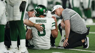 <p>SEASON ENDING INJURY: New York Jets quarterback Aaron Rodgers (8) is tended to on the field during the first quarter of an NFL football game against the Buffalo Bills. Pic: AP Photo/Seth Wenig</p>