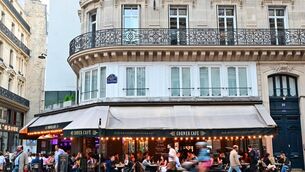 <p>People sit at the terrace of a cafe in the 2nd arrondissement of Paris, where signs of the Rugby World Cup are hard to find.	<span class="contextmenu emphasis CaptionCredit">Picture: Miguel Medina/AFP via Getty Images</span>
            </p>