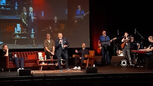 <p>George Hamilton gets the crowd singing along at the Second Captains gig at the Olympia. </p>