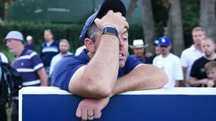 <p>Rory McIlroy reacts at the long wait on the 18th tee on day two of the BMW PGA Championship. Pic: Zac Goodwin/PA</p>