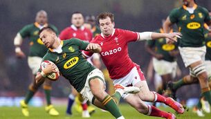 <p>South Africa's Handre Pollard (left) tackled by Wales' Nick Tompkins. Pic: David Davies/PA Wire. </p>