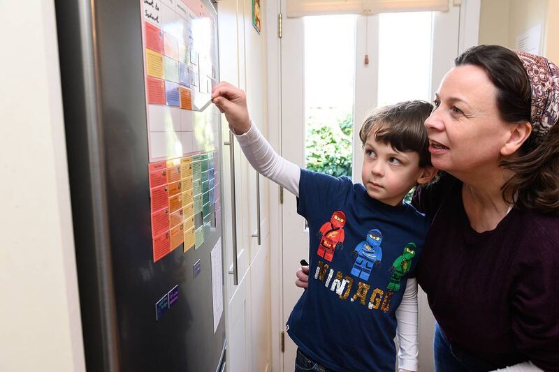 Magneplan founder Nicole using the magnetic board with her son, Will.