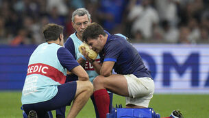 <p>France's Antoine Dupont receives treatment after taking a knock to the head during the Rugby World Cup Pool A match between France and Namibia at the Stade de Marseille in Marseille, France, Thursday, Sept. 21, 2023. (AP Photo/Daniel Cole)</p>