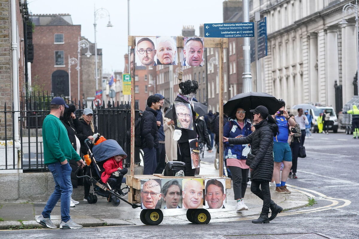 On Wednesday, passers-by on Dublin's Kildare Street encountered protesters with mock gallows and effigies of politicians outside Leinster House, the seat of government in Ireland. Picture: Brian Lawless/PA On Wednesday, passers-by on Dublin's Kildare Street encountered protesters with mock gallows and effigies of politicians outside Leinster House, the seat of government in Ireland. Picture: Brian Lawless/PA