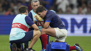 <p>LAY-OFF: France's Antoine Dupont receives treatment after taking a heavy knock to the head against Namibia. Picture: AP Photo/Daniel Cole</p>