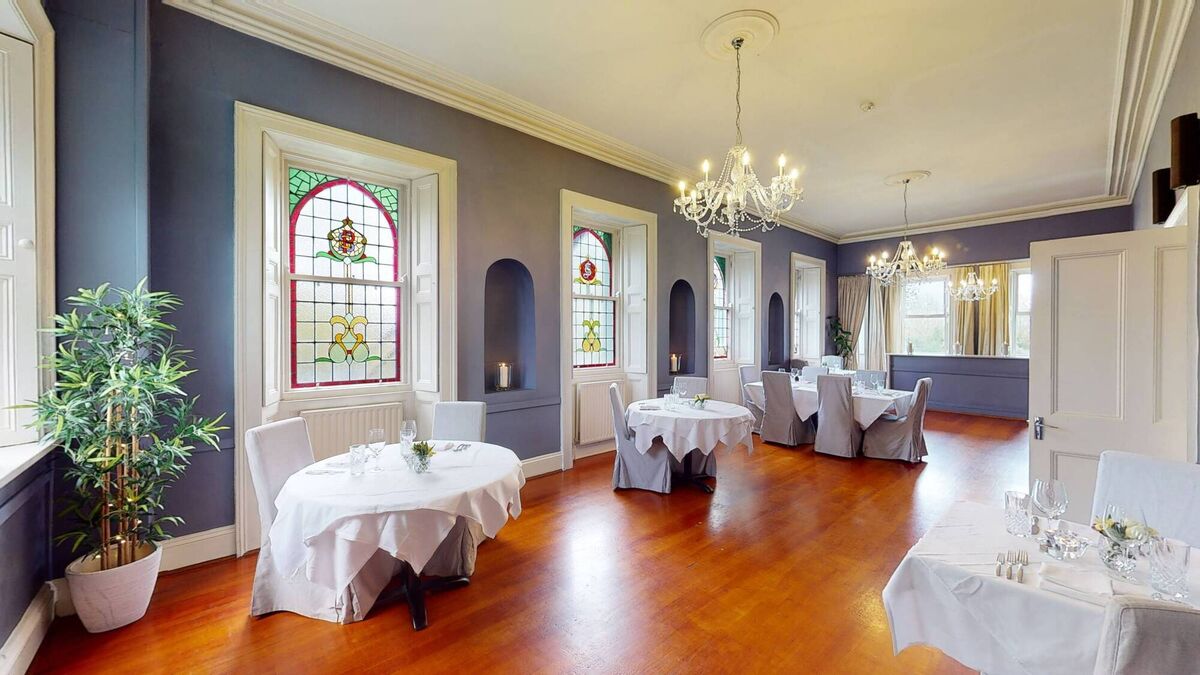 Stained glass windows feature lightly in the dining room