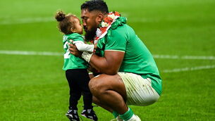 <p>Ireland's Bundee Aki celebrates with his youngest child Ailbhe Lasela Ali'itasi Aki in Paris. Picture: Brendan Moran/Sportsfile</p>