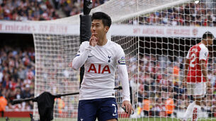 <p>HONOURS EVEN: Tottenham's Son Heung-min celebrates. Pic: AP Photo/David Cliff.</p>