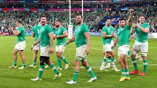 <p>JOB DONE - FOR NOW: The Ireland team applaud the fans after the final whistle in the Rugby World Cup 2023, Pool B match at the Stade de France. Pic: PA</p>
