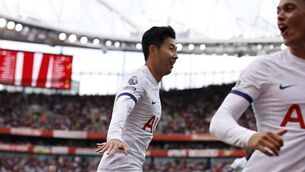 <p>Tottenham's Son Heung-min celebrates after scoring his side's second goal during the Premier League match against Arsenal at Emirates stadium. Pic: AP Photo/David Cliff</p>