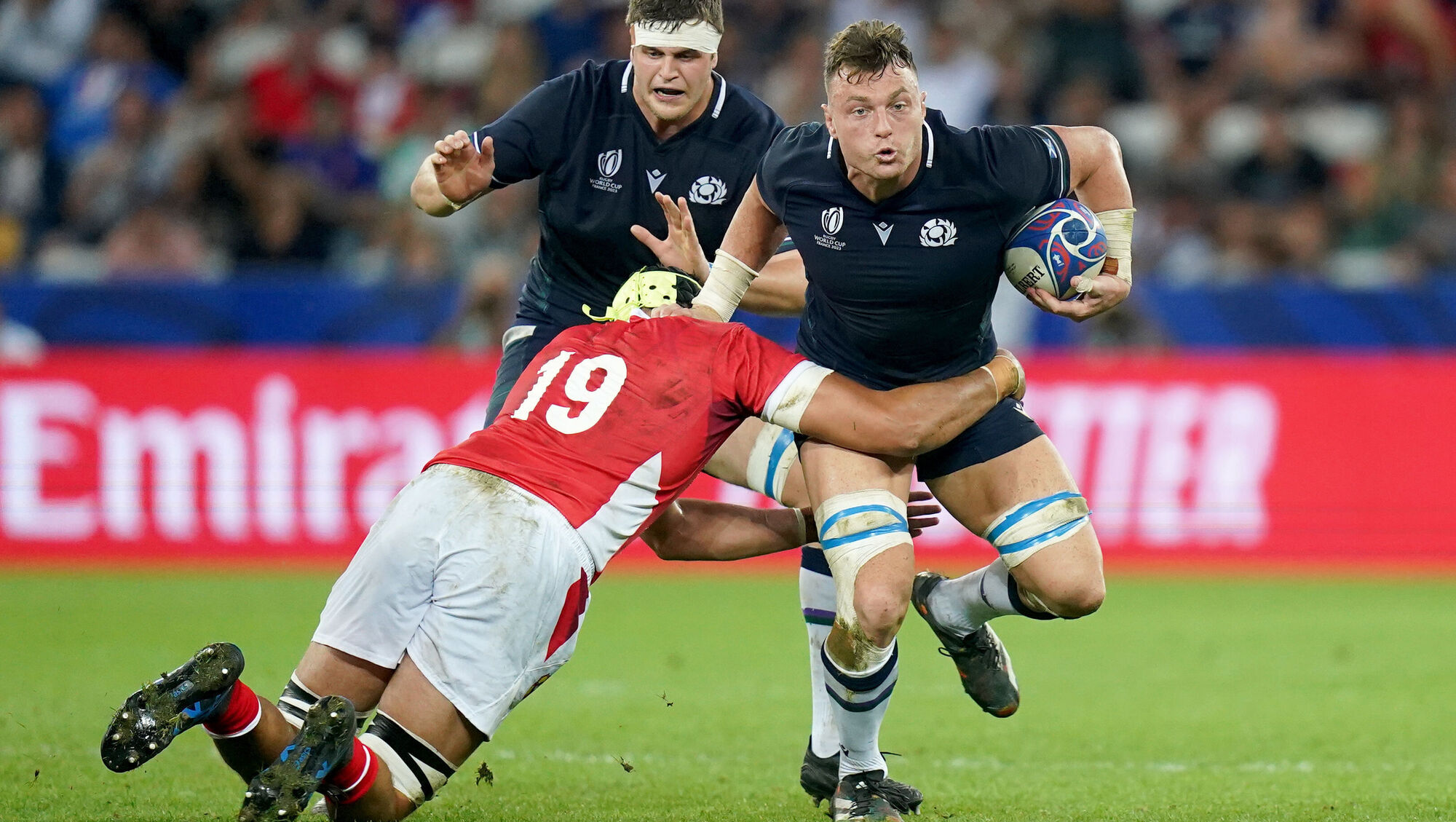 BREAKING THROUGH: Scotland's Jack Dempsey is tackled by Tonga's Adam Coleman at the Stade de Nice. Picture: Adam Davy/PA Wire.