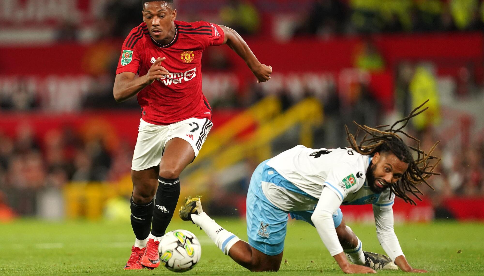 Manchester United's Anthony Martial (left) and Crystal Palace's Jairo Riedewald battle for possession.