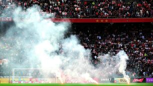 <p>ANGER: Smoke rising from fireworks thrown on the field by Ajax' supporters during the Dutch Eredivisie football match against Feyenoord at the Johan Cruijff Arena in Amsterdam. Pic: Olaf Kraak/ANP/AFP via Getty Images</p>