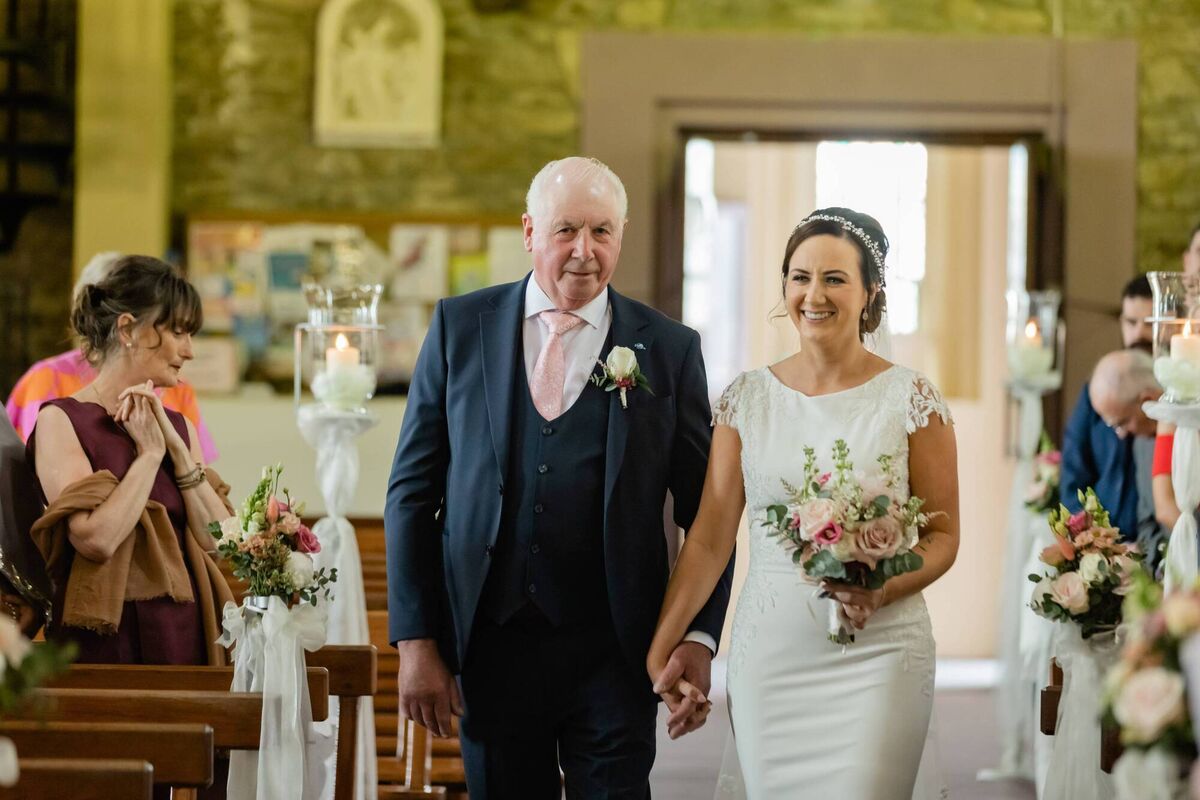 Marie Murphy and Paddy Murphy walking up the aisle. Pictures: Tara Donoghue Photography Marie Murphy and Paddy Murphy walking up the aisle. Pictures: Tara Donoghue Photography