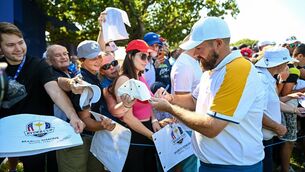 <p>CROWD PLEASER: Shane Lowry signs autographs after practice for the Ryder Cup at Marco Simone Golf and Country Club in Rome. Pic: Ramsey Cardy/Sportsfile</p>