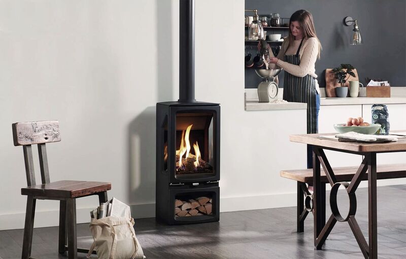 Gazco Vogue Midi T Midline three-sided Balanced Flue gas stove with its stunning flame show and log box; €4,350, thegascompany.ie.