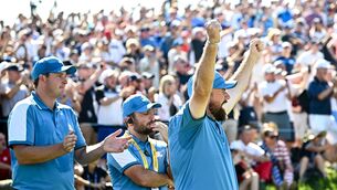 <p>CLEAN SWEEP: Shane Lowry, right, and Sepp Straka of Europe celebrate on the 17th green, after teammates Rory McIlroy and Tommy Fleetwood won their match. Pic: Ramsey Cardy/Sportsfile</p>