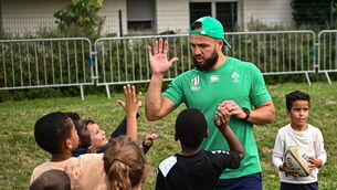 <p>OFF-WEEK: Jamison Gibson-Park with children during an Ireland rugby visit to Drop Quartier Rugby ran by UST Tour Rugby. Pic: Harry Murphy/Sportsfile</p>