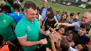 <p>SOLID ENVIRONMENT: Dave Kilcoyne signs autographs with members of Drop Quartier Rugby. Pic: ©INPHO/Dan Sheridan</p>