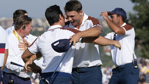<p>Europe’s Viktor Hovland, left and Europe’s Ludvig Aberg hug on the 11th green after defeating the United States pair of Scottie Scheffler and Brooks Koepka. Pic: Gregorio Borgia/AP</p>