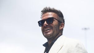 <p>GOLDEN: David Beckham smiles at the F1 Grand Prix of Miami. Picture: Jared C. Tilton/Getty Images</p>