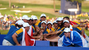Team Europe captain Luke Donald lifts the Ryder Cup (David Davies/PA)