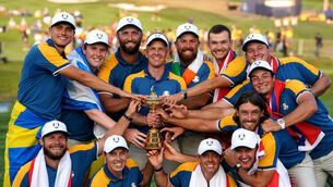 Captain Luke Donald and his players hold the Ryder Cup (David Davies/PA)