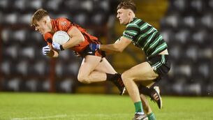 <p>FLYING MILSTREET MAN: Duhallow's Darragh Cashman wins is tackled by Douglas' Eoghan Nash during the Bon Secours Cork Premier SFC quarter final at Pairc Ui Rinn. Pic: Eddie O'Hare</p>
