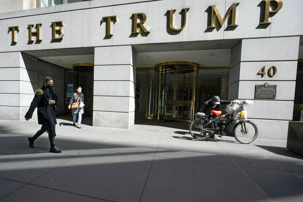 Pedestrians and a food delivery man are seen outside the Trump building on Wall Street in New York's Financial District. File Picture: AP Photo/Mary Altaffer Pedestrians and a food delivery man are seen outside the Trump building on Wall Street in New York's Financial District. File Picture: AP Photo/Mary Altaffer