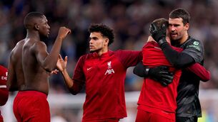 <p>DEJECTED: Liverpool goalkeeper Alisson Becker hugs a team-mate at the end of the Premier League match against Spurs at Tottenham Hotspur Stadium. Pic: John Walton/PA Wire</p>