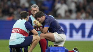 <p>France's Antoine Dupont receives treatment for the facial fracture that threatens his Rugby World Cup</p>