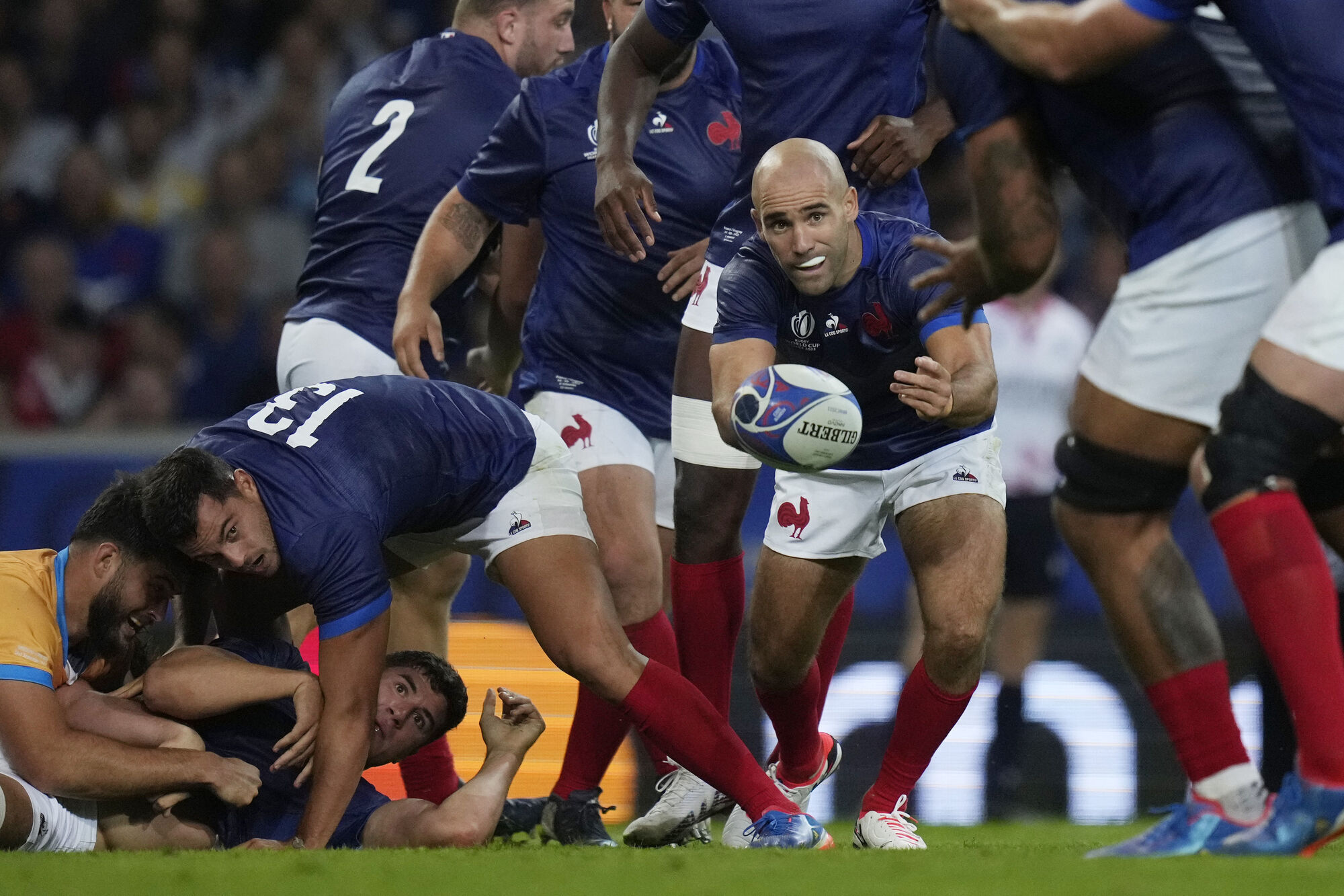 INJURY COVER: France's Maxime Lucu, centre, passes the ball. Pic: AP Photo/Thibault Camus
