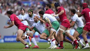 <p>MINNOWS: Georgia's Davit Niniashvili, left, is pulled back during the Rugby World Cup Pool C match against Portugal. Pic: AP Photo/Lewis Joly</p>