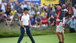 <p>Rory McIlroy of Europe and Joe LaCava, caddy to Patrick Cantlay of USA, on the 18th green during the afternoon fourball matches on day two of the 2023 Ryder Cup. Pic: Ramsey Cardy/Sportsfile</p>