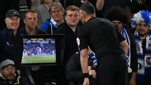 <p>CHECK ONGOING: Now-retired referee Andre Marriner consults the pitchside monitor for a VAR check earlier in the year. Pic: Glyn Kirk/AFP</p>