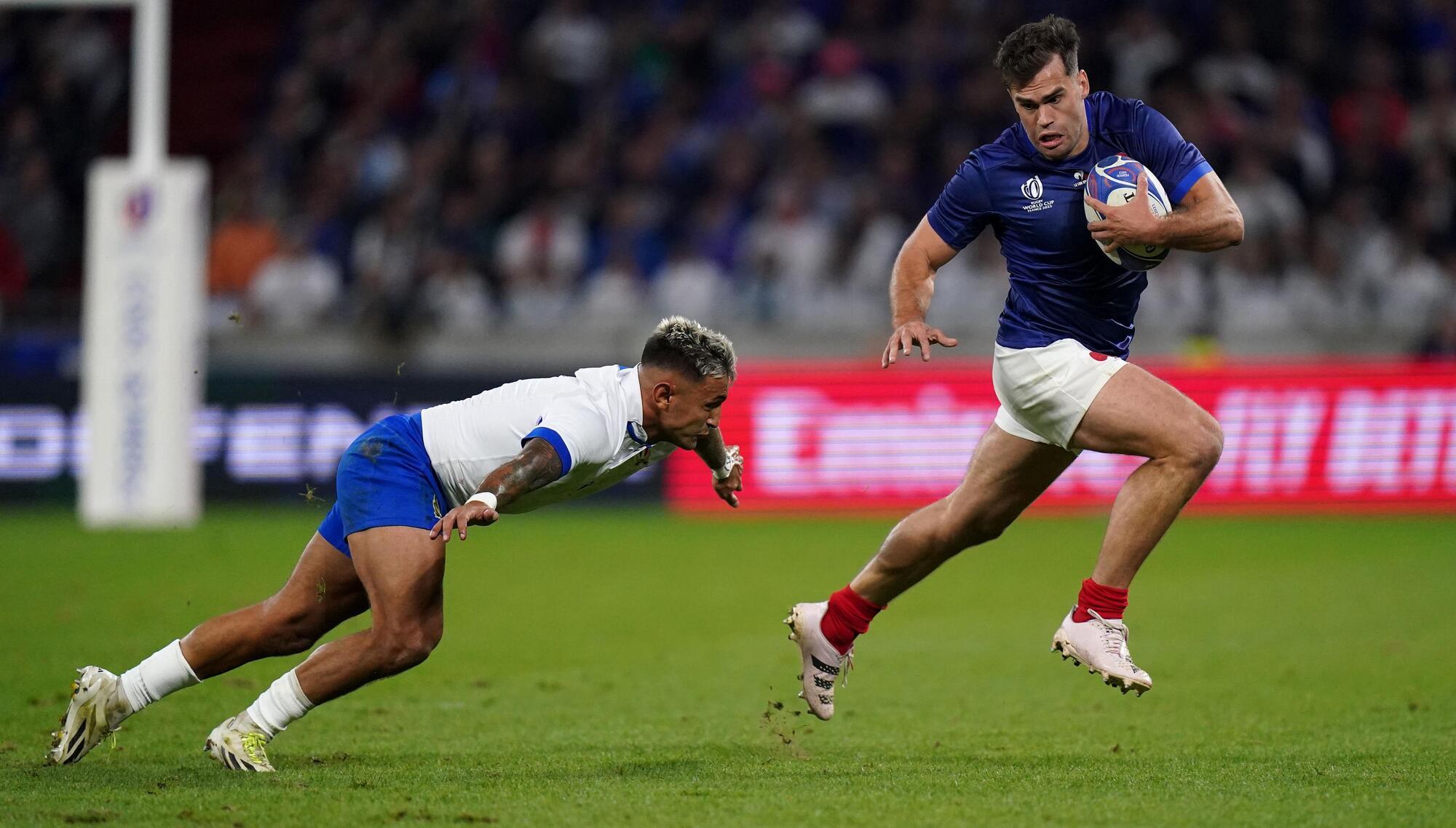 CATCH ME IF YOU CAN: Italy's Pierre Bruno tries to tackle France's Damian Penaud during the Rugby World Cup 2023, Pool A match at OL Stadium in Lyon. Pic: Adam Davy/PA Wire